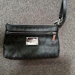 Michael Kors small black clutch, good condition used once.
